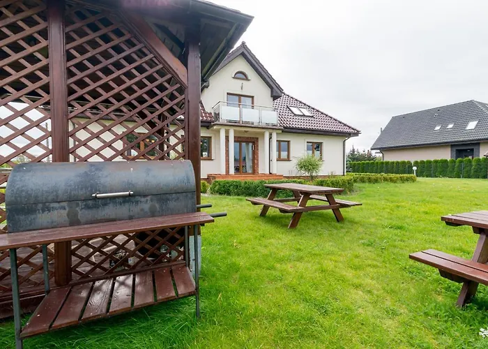 Bursztynowy Dworek Rum i privatbostad Łeba